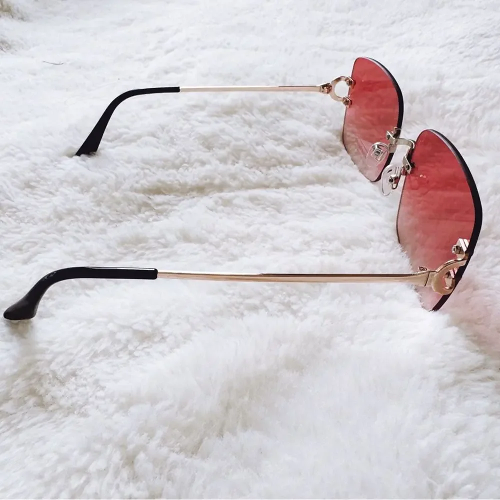 Laurel Clear Orange Rimless Sleek Sunglasses